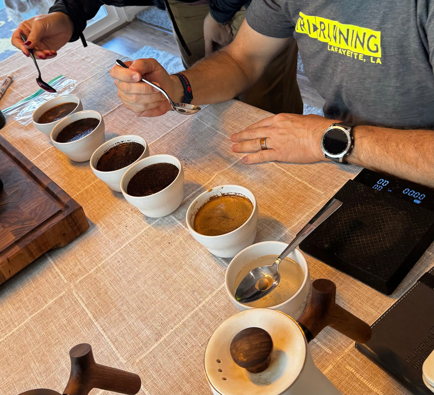 My parents cupping different roast profiles of the blend to find exactly what they like!